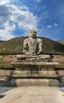 Stone Buddha image on ruins at Polonnaruwa, Sri Lanka