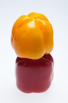 close up of red and yellow peppers