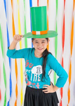 Cute Asian-Thai girl holds big green hat on St.Patrick's Day