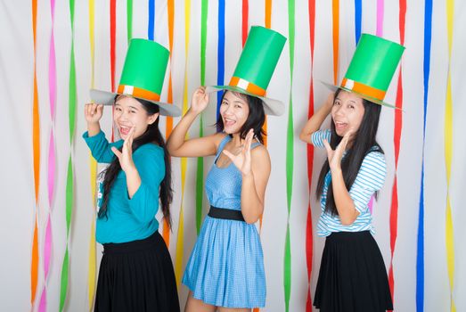Asian-Thai girls hold big green hat on St.Patrick's Day