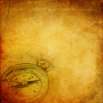 Aged paper background with an old compass and map pattern