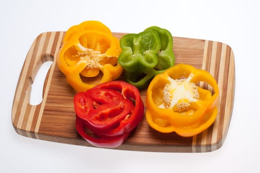 close up of red, yellow and green peppers