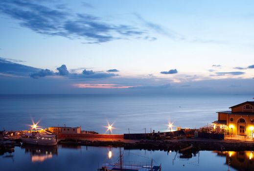 View of boats at sunset in the Piran harbor, Slovenia