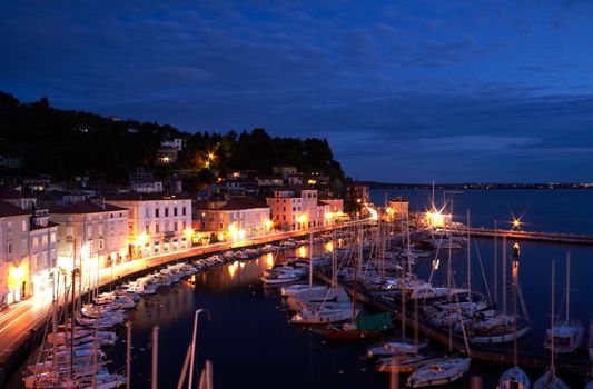 View of boats at sunset in the Piran harbor, Slovenia