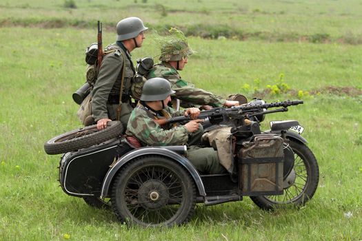 Odessa ,UKRAINE. May 8, 2011. German soldiers of WW2 at the combat. Military history club. Historical military reenacting. Demonstration for public historical reconstrucrion of one of combats between Soviet and German armies. German uniform WW2