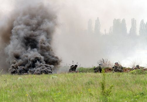 Odessa ,UKRAINE. May 8, 2011. German soldiers of WW2 at the combat. Military history club. Historical military reenacting. Demonstration for public historical reconstrucrion of one of combats between Soviet and German armies. German uniform WW2