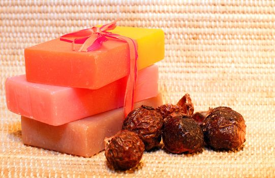 Handmade Soap and soap nuts on the bamboo placemat. Spa products