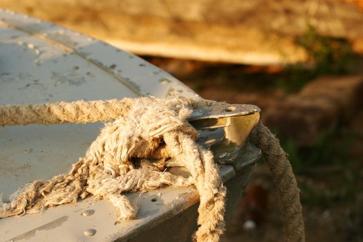 Old rope on the bow  of an old boat in the liman (lake) near Odessa, Ukraine