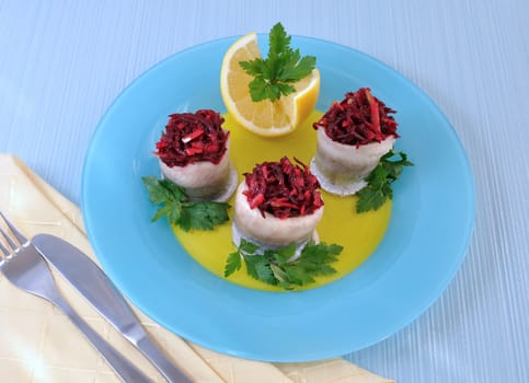 Herring fillet stuffed with beet-apple stuffing with herbs
