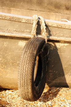 Tire bumpers on a old boat in the liman (lake) near Odessa, Ukraine