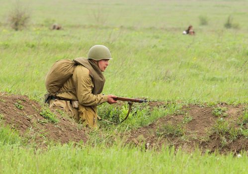 Odessa ,UKRAINE. May 8, 2011. German soldiers of WW2 at the combat. Military history club. Historical military reenacting. Demonstration for public historical reconstrucrion of one of combats between Soviet and German armies. Soviet uniform WW2