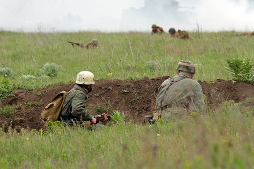 Odessa ,UKRAINE. May 8, 2011. German soldiers of WW2 at the combat. Military history club. Historical military reenacting. Demonstration for public historical reconstrucrion of one of combats between Soviet and German armies. German uniform WW2