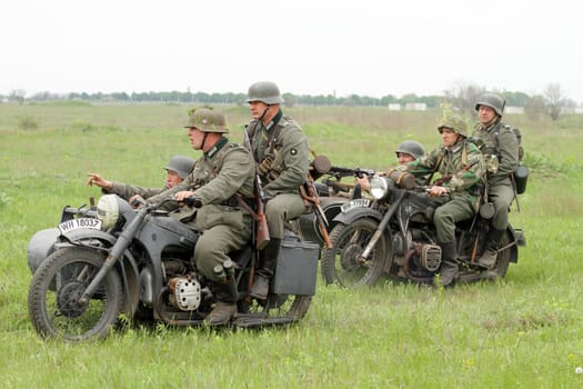 Odessa ,UKRAINE. May 8, 2011. German soldiers of WW2 at the combat. Military history club. Historical military reenacting. Demonstration for public historical reconstrucrion of one of combats between Soviet and German armies. German uniform WW2