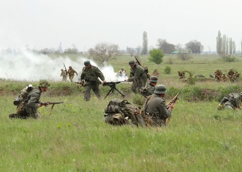 Odessa ,UKRAINE. May 8, 2011. German soldiers of WW2 at the combat. Military history club. Historical military reenacting. Demonstration for public historical reconstrucrion of one of combats between Soviet and German armies. German and soviet uniform and ammo WW2