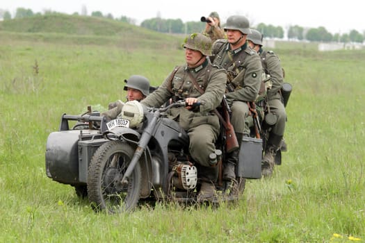 Odessa ,UKRAINE. May 8, 2011. German soldiers of WW2 at the combat. Military history club. Historical military reenacting. Demonstration for public historical reconstrucrion of one of combats between Soviet and German armies. German uniform WW2