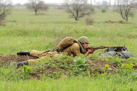 Odessa ,UKRAINE. May 8, 2011. Soviet soldiers of WW2 at the combat. Military history club. Historical military reenacting. Demonstration for public historical reconstrucrion of one of combats between Soviet and German armies. German uniform WW2