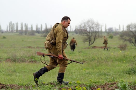 Odessa ,UKRAINE. May 8, 2011. Soviet soldiers of WW2 at the combat. Military history club. Historical military reenacting. Demonstration for public historical reconstrucrion of one of combats between Soviet and German armies. German uniform WW2