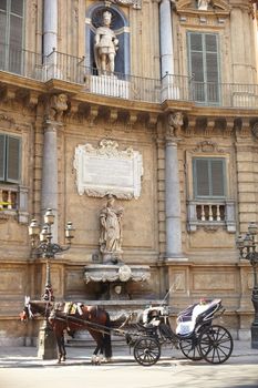 Buggy in the Quattro Canti, one of the octagonal four sides of Baroque square in Palermo - Italy
