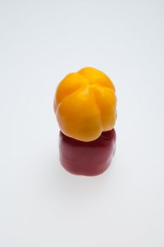close up of red and yellow peppers