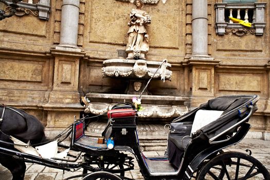 Buggy in the Quattro Canti, one of the octagonal four sides of Baroque square in Palermo - Italy