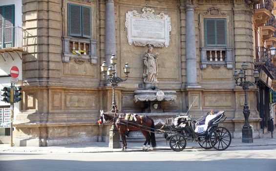 Buggy in the Quattro Canti, one of the octagonal four sides of Baroque square in Palermo - Italy