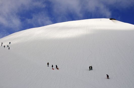 People on Etna, volcano of Sicily covered by snow
