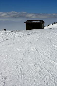 Wooden house on Etna Volcan covered by snow - Italy