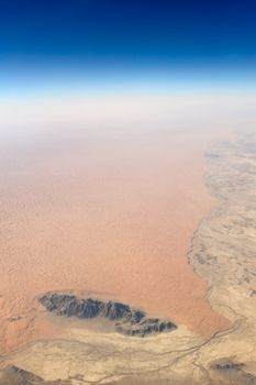 Aerial view of barren desert and rocks