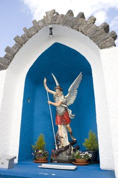 a statue of saint michael slaying the devil in county Kerry Ireland