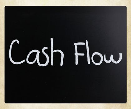 "Cash flow" handwritten with white chalk on a blackboard