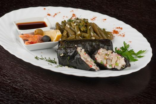 souffle of fillet of pikeperch, shrimps, crab meat, coconut and leek wrapped at nori garnished by string beans