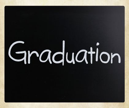 The word "Graduation" handwritten with white chalk on a blackboard
