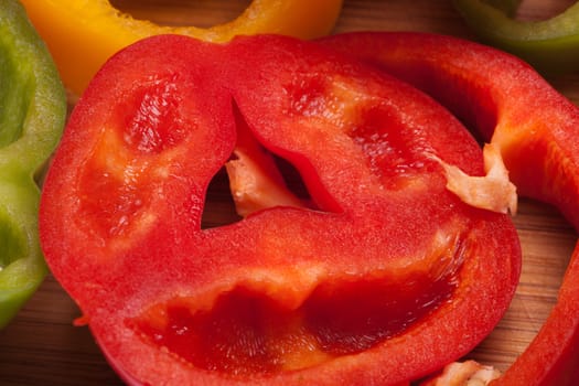 close up of red, yellow and green peppers