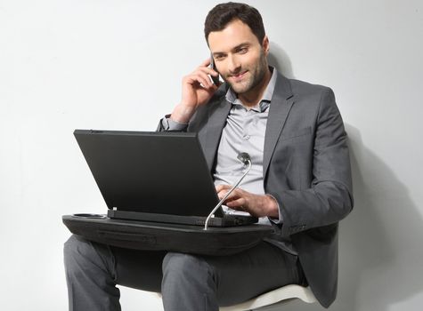 Young businessman working on is laptop