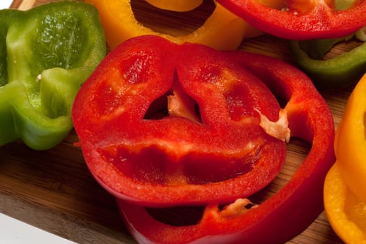 close up of red, yellow and green peppers