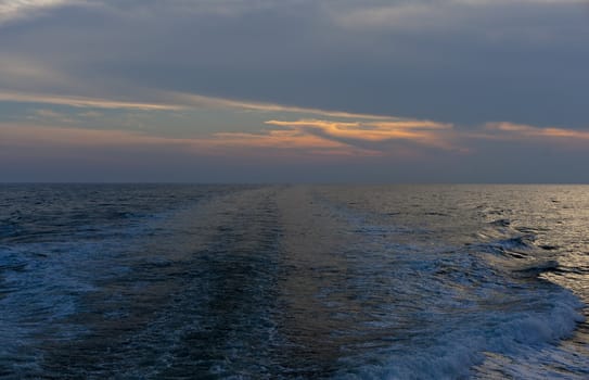 Wawe on the sea at sunset