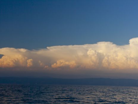 Cloudy sky on the sea at sunset