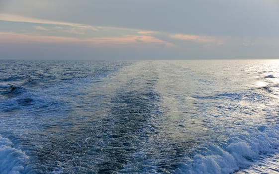 Wawe on the sea at sunset