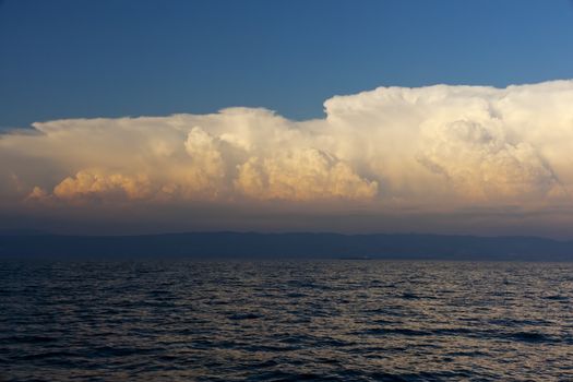 Cloudy sky on the sea at sunset