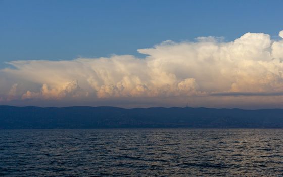 Cloudy sky on the sea at sunset