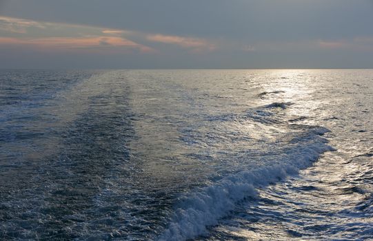 Wawe on the sea at sunset