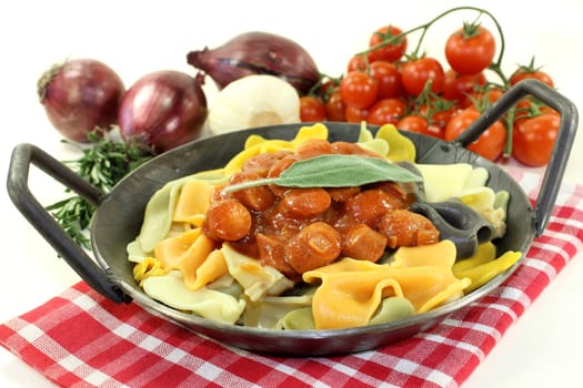 Pasta with tomato sauce and Mediterranean herbs