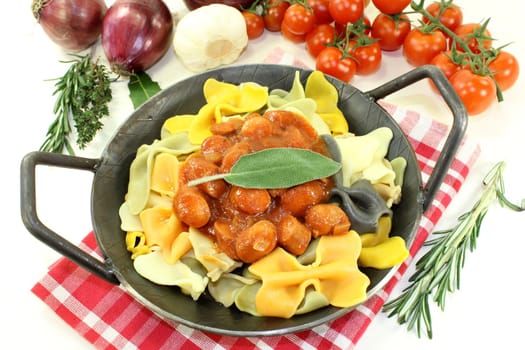 Pasta with tomato sauce and Mediterranean herbs