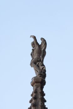 Statue of an Angel wings on the spire, Milan cathedral - Italy