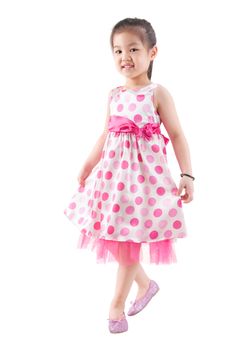 Full body Asian girl in pink dress dancing happily on white background