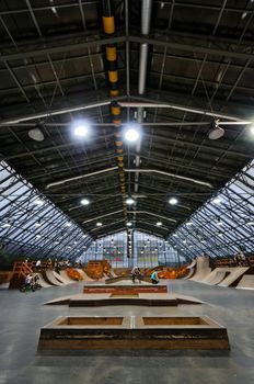 Skate park symmetric vertical interior with bike riders