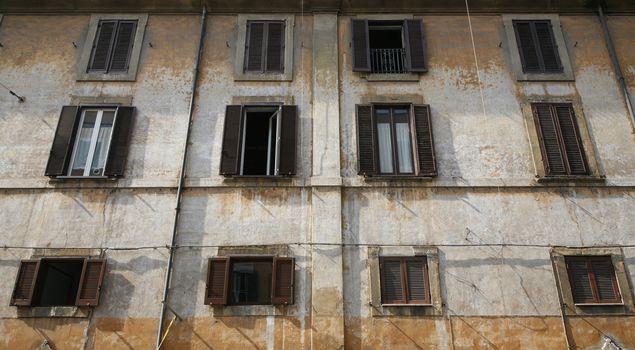 Grunge facade of apartment house in the district of Trastevere - Rome, Italy.