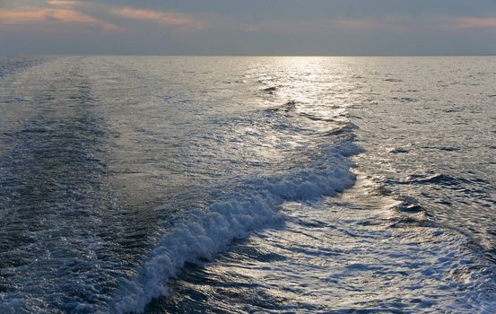 Wawe on the sea at sunset