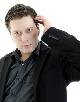 Portrait of a handsome young business man straightening his hair. Isolated on white background with copy space.