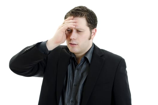 Portrait of a young business man looking depressed from work. Isolated over white background